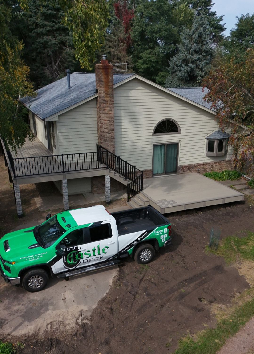 House with truck parked nearby.
