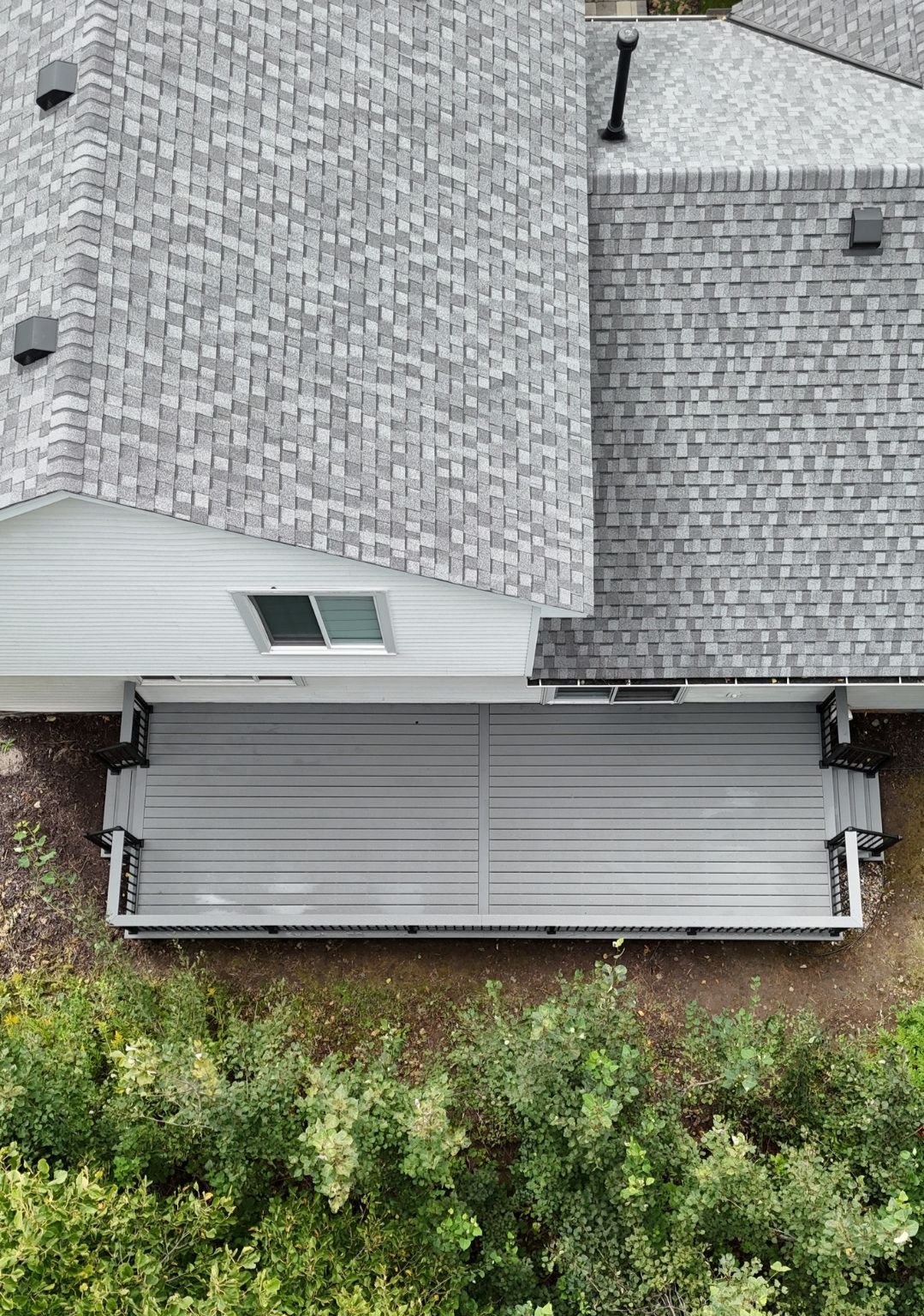 Aerial view of house and deck.